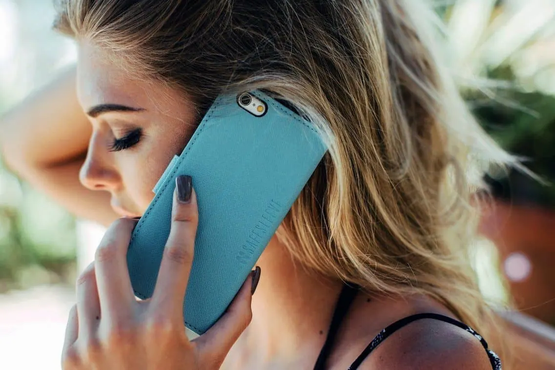 Woman holding a smartphone to her ear during a call