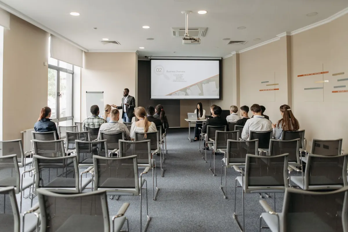 Group attending a training presentation in a seminar room