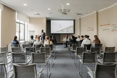 Group attending a training presentation in a seminar room