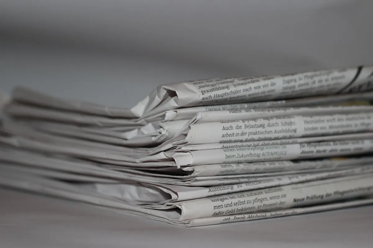 Stack of folded printed newspapers