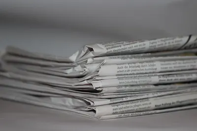 Stack of folded printed newspapers