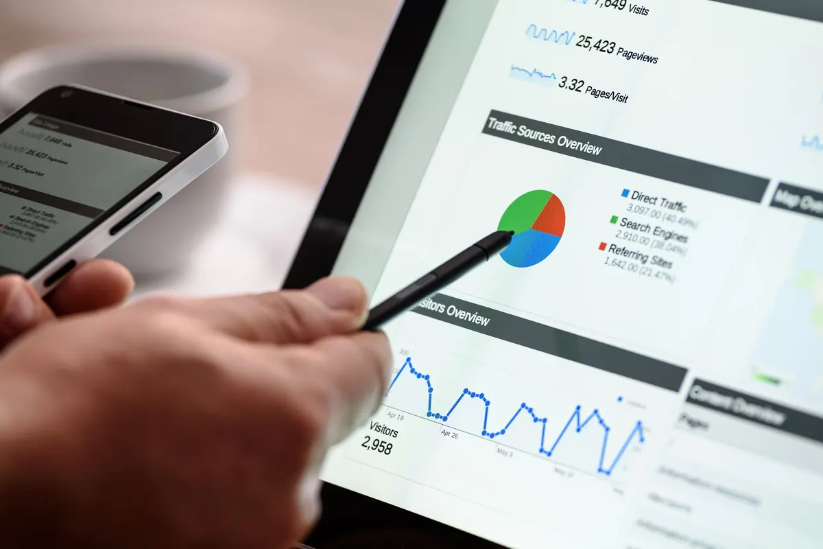 Tablet showing website traffic analytics next to a smartphone