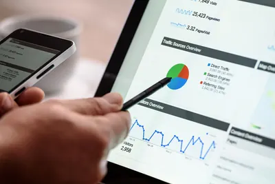 Tablet showing website traffic analytics next to a smartphone
