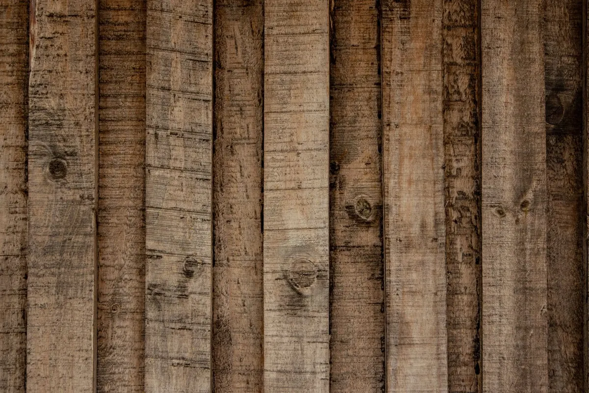 Weathered reclaimed wood planks, a sustainable building material