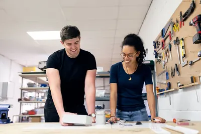 Two makers testing a product prototype in a workshop